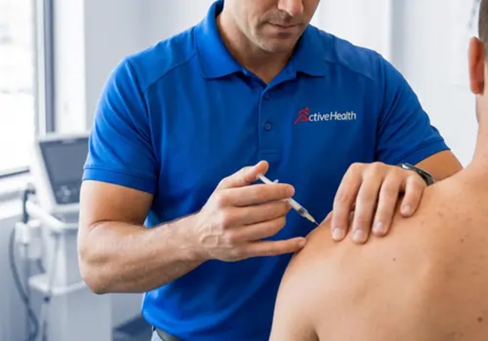Active Health clinician treating a patient's lower back pain